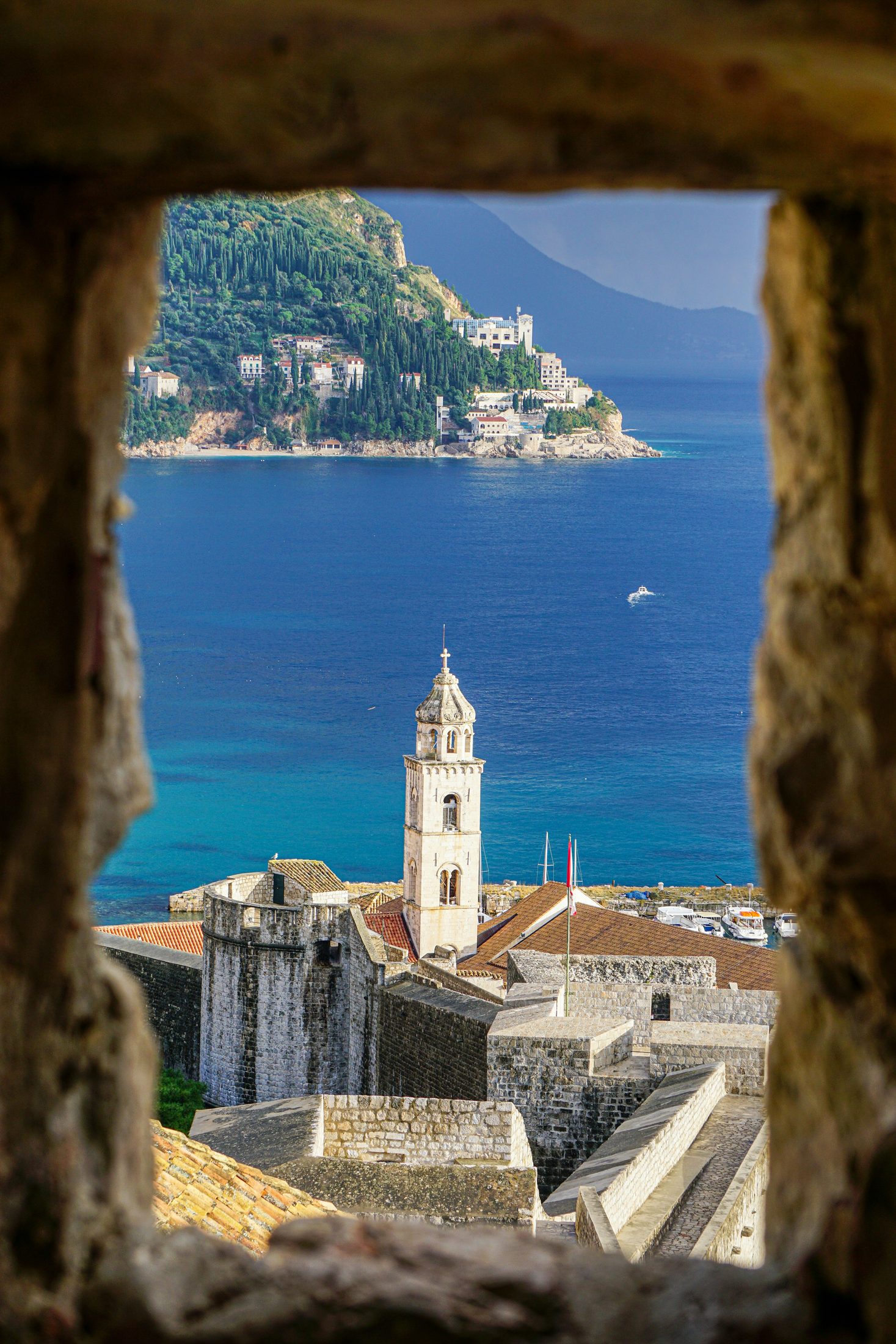 Dubrovnik's stone walls, bell tower, and Lokrum island viewed from the old city