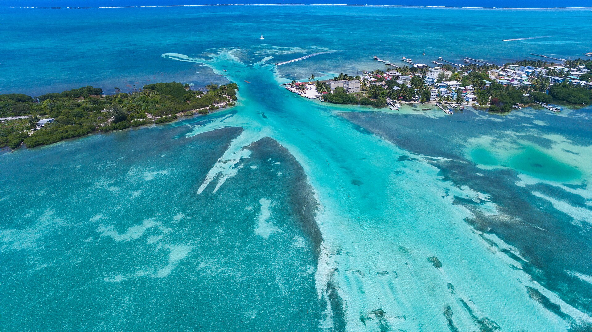 Caye Caulker and turquoise reef channels seen from above