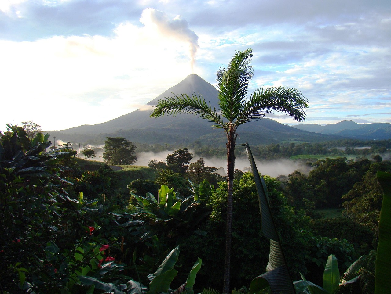 Arenal Volcano rising above tropical rainforest in Costa Rica