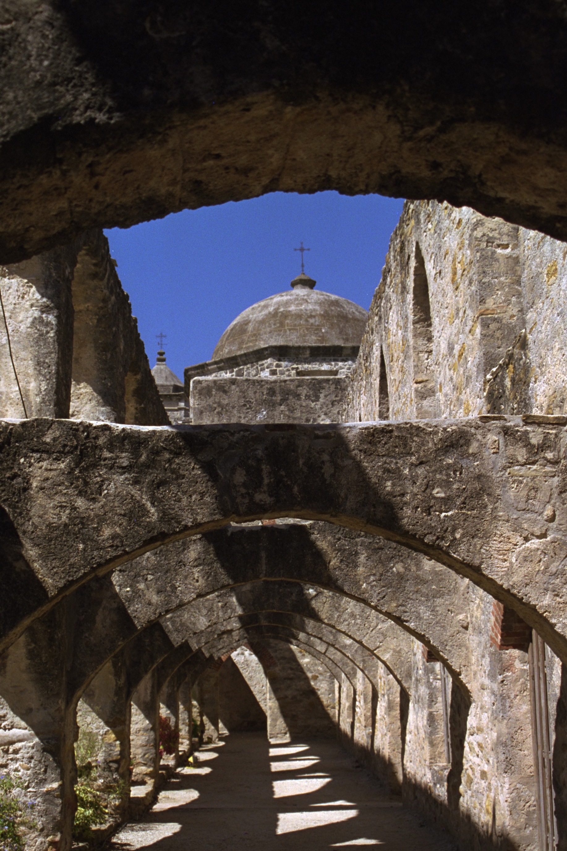 The ornate stone church façade of Mission San José in San Antonio