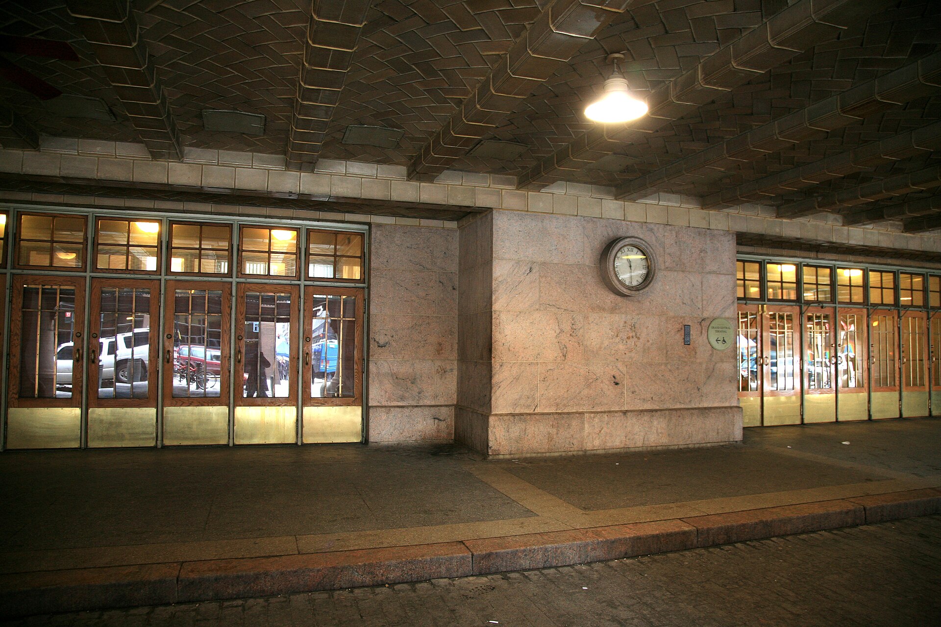 Arched entrance and clock beneath Grand Central Terminal's elevated roadway