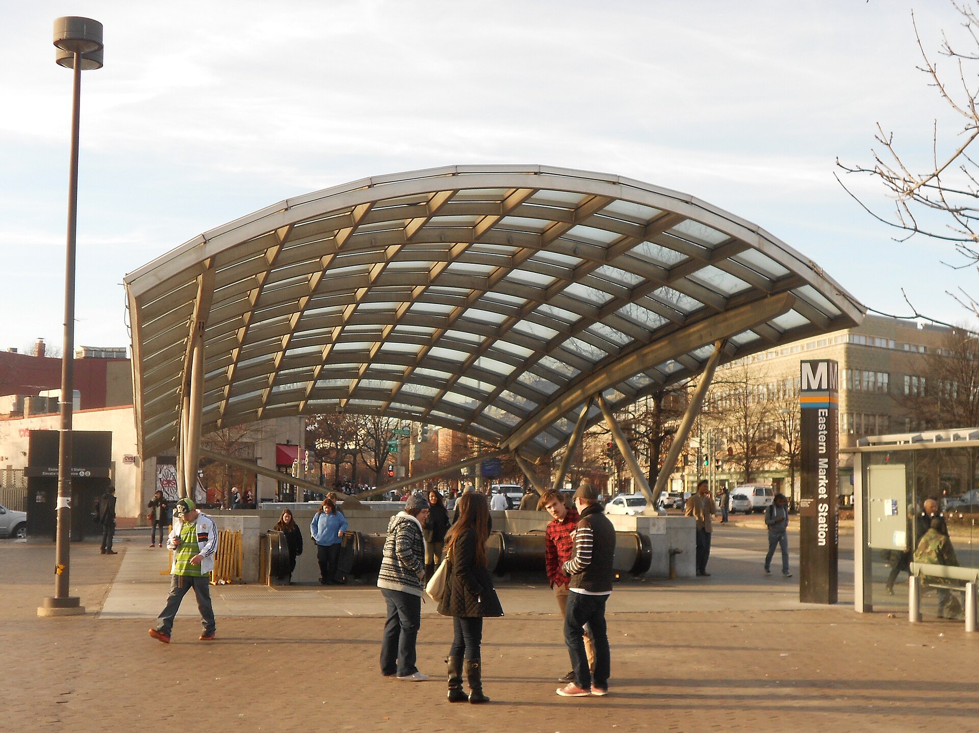 Travelers and local street activity at Eastern Market Metro station