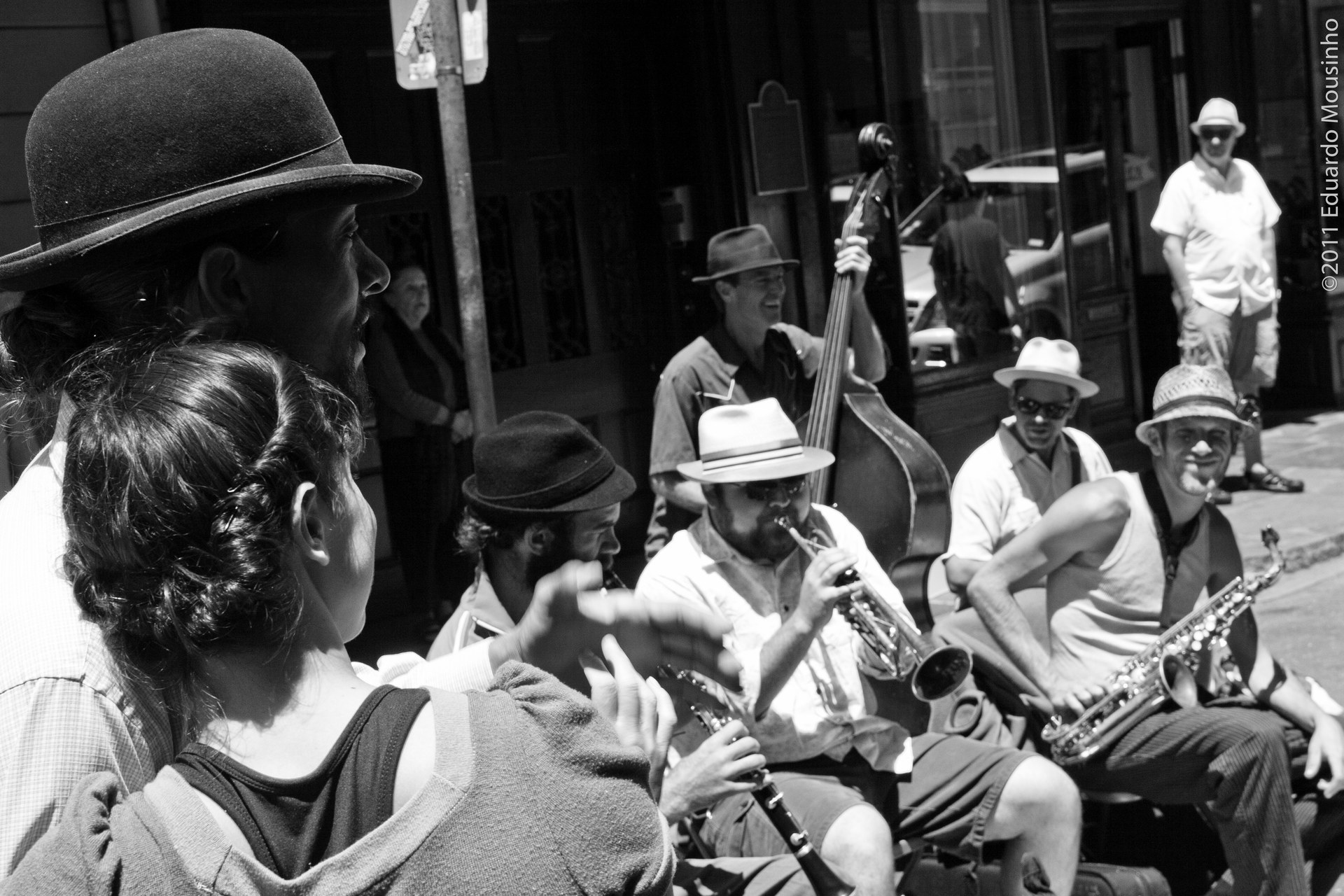 A New Orleans street-jazz ensemble playing to an engaged crowd