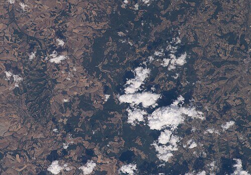How to pace the visit for Florence: ISS067 E 152543 View of Tuscany, Volterra, upper Era valley, agriculture, forest of Poggio del Comune, San Gimignano (cropped)