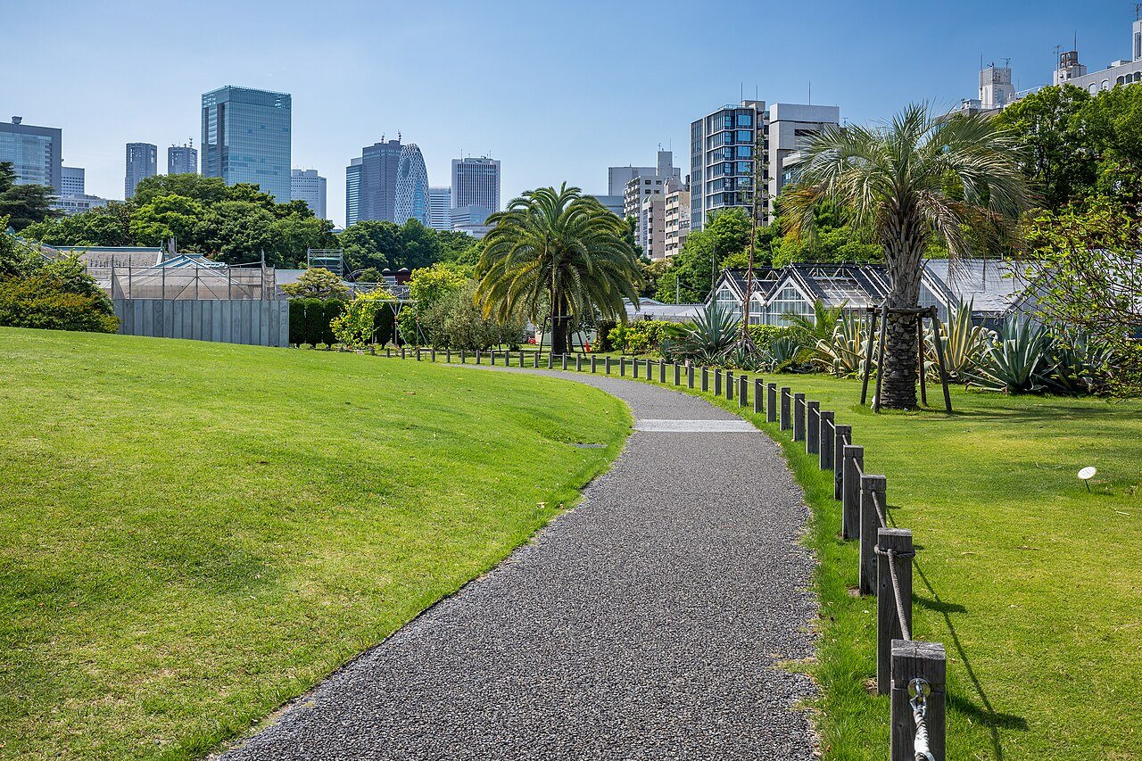 Shinjuku: A path from the greenhouse in Shinjuku Gyoen National Garden in Shinjuku, Tokyo, Japan, 2024 May