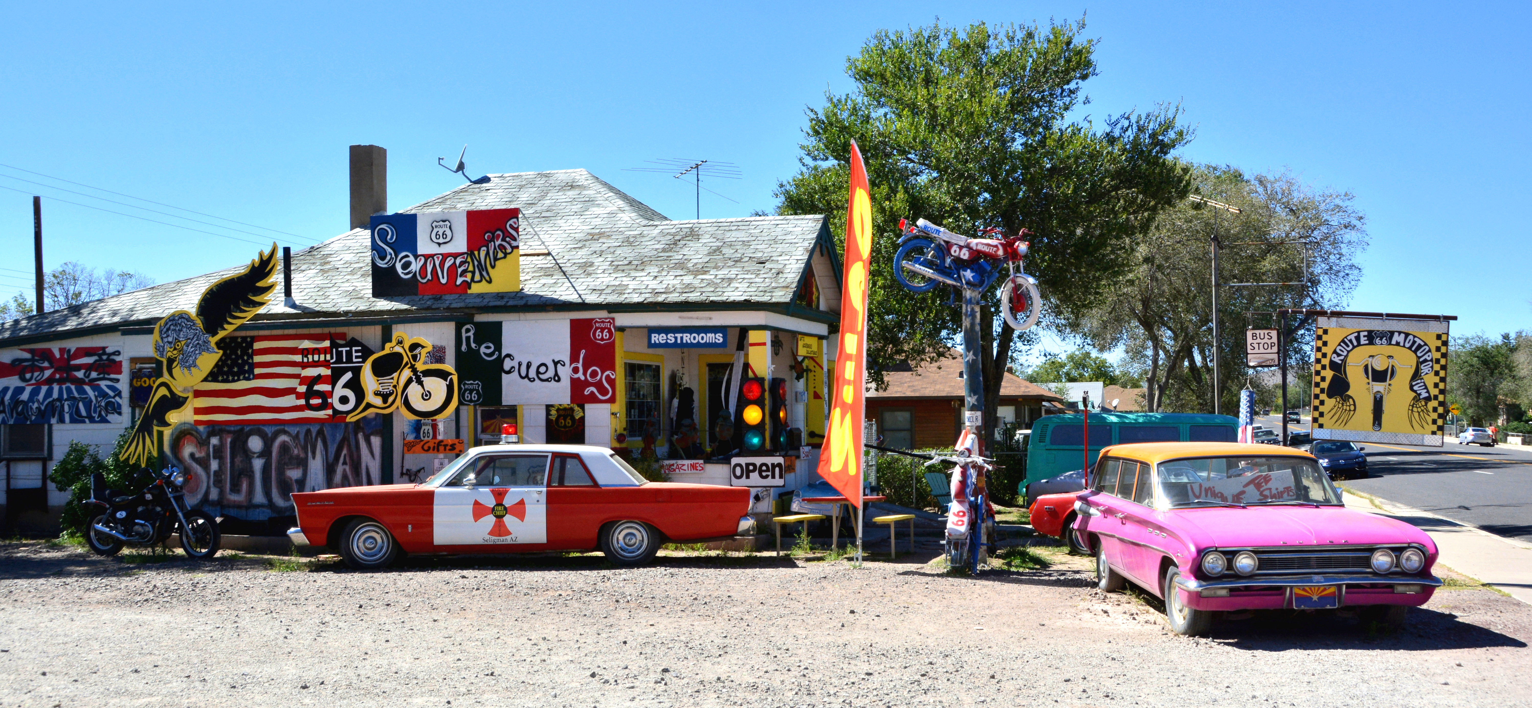 Colorful Route 66 shops, vintage cars, road signs, and the main street animate Seligman, Arizona