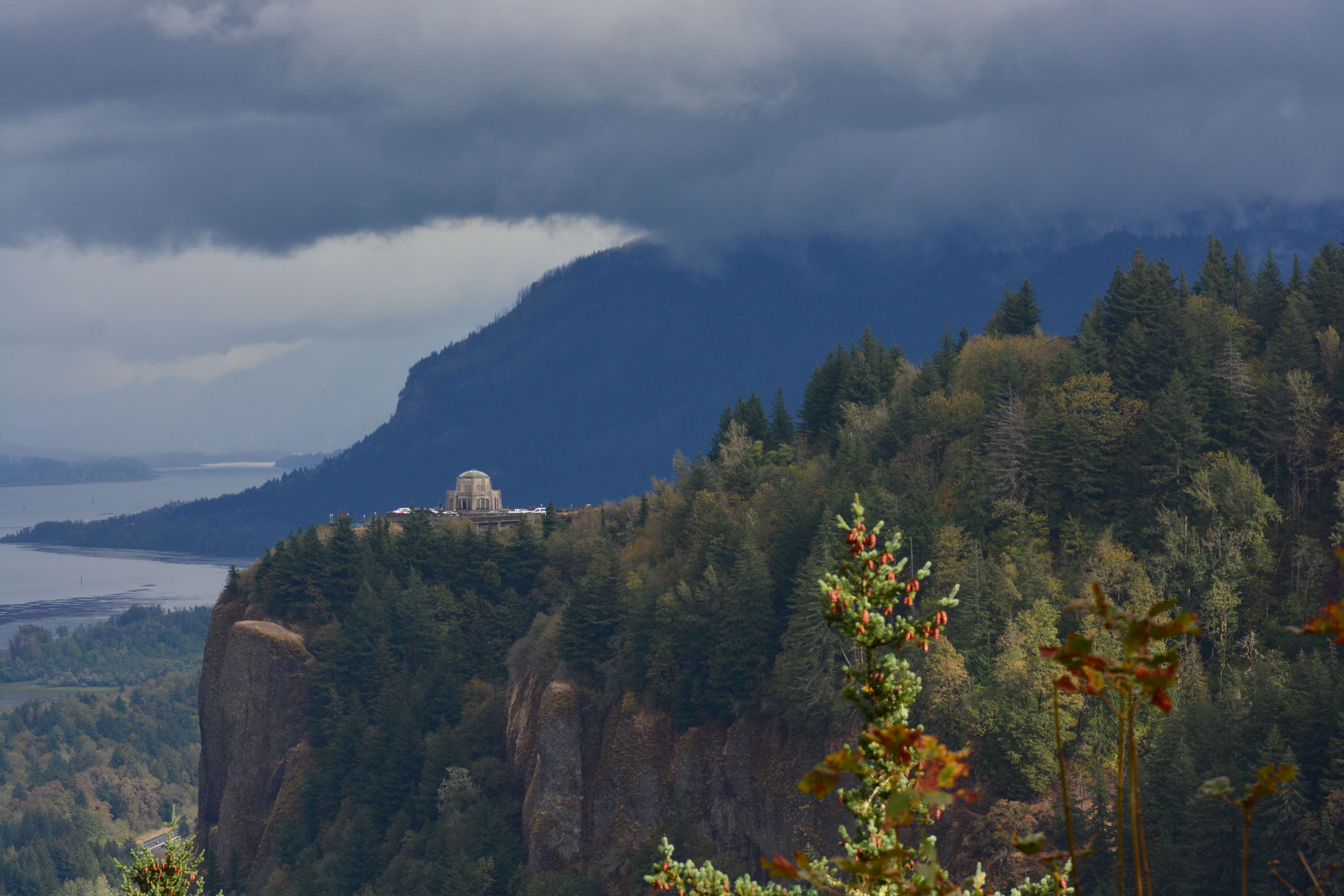Crown Point Vista House above the forested cliffs and Columbia River Gorge in Oregon