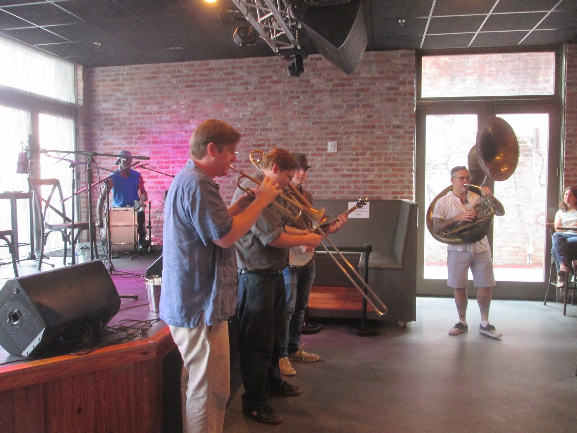 A brass band performing live inside a Frenchmen Street music venue