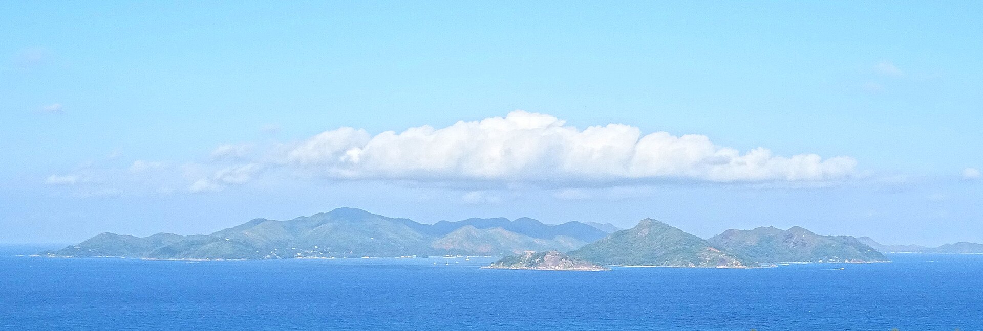 Praslin and Baie Sainte Anne seen across the channel from La Digue, Seychelles