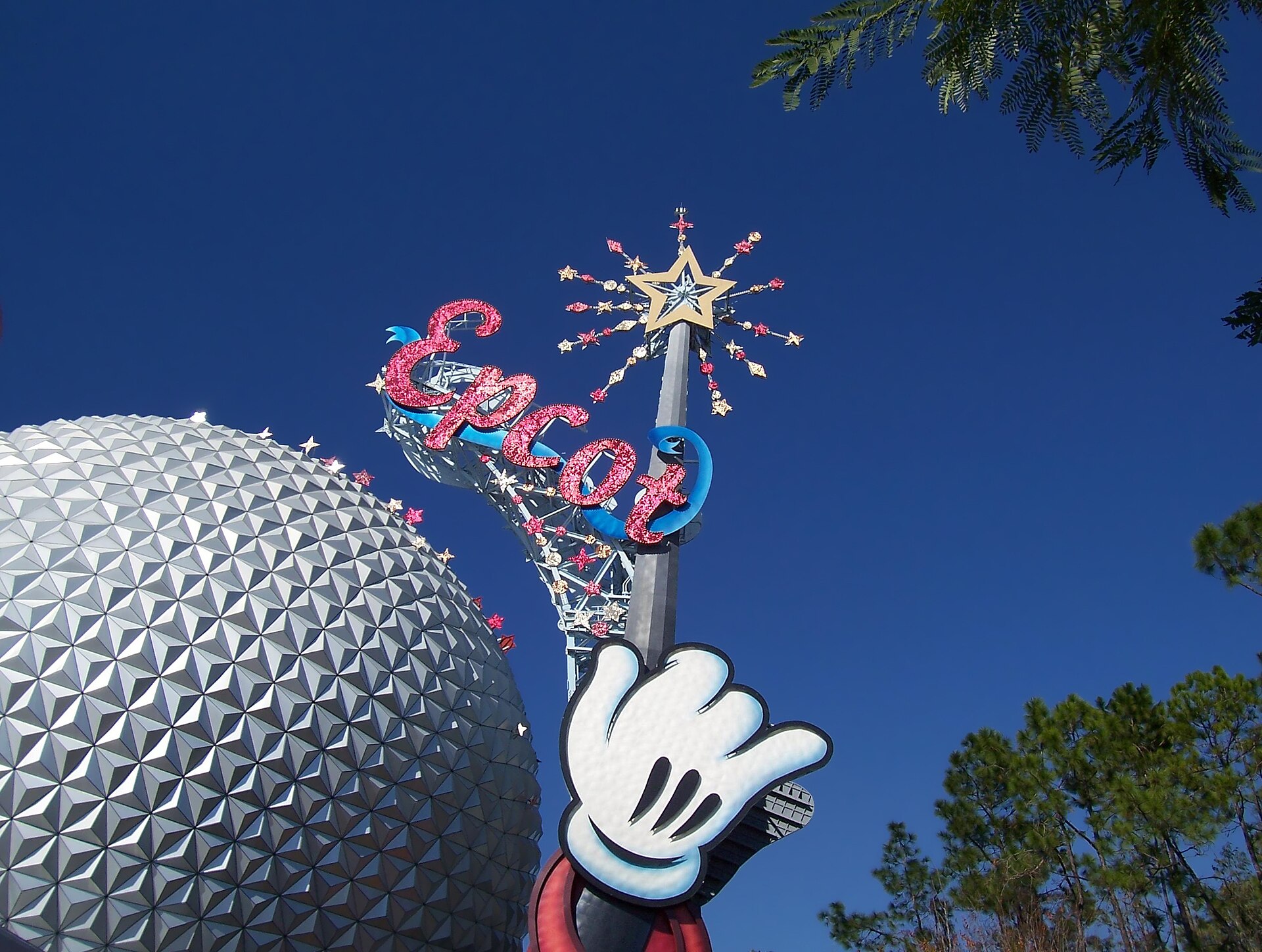 Epcot's geodesic sphere and illuminated entrance sculpture in Orlando