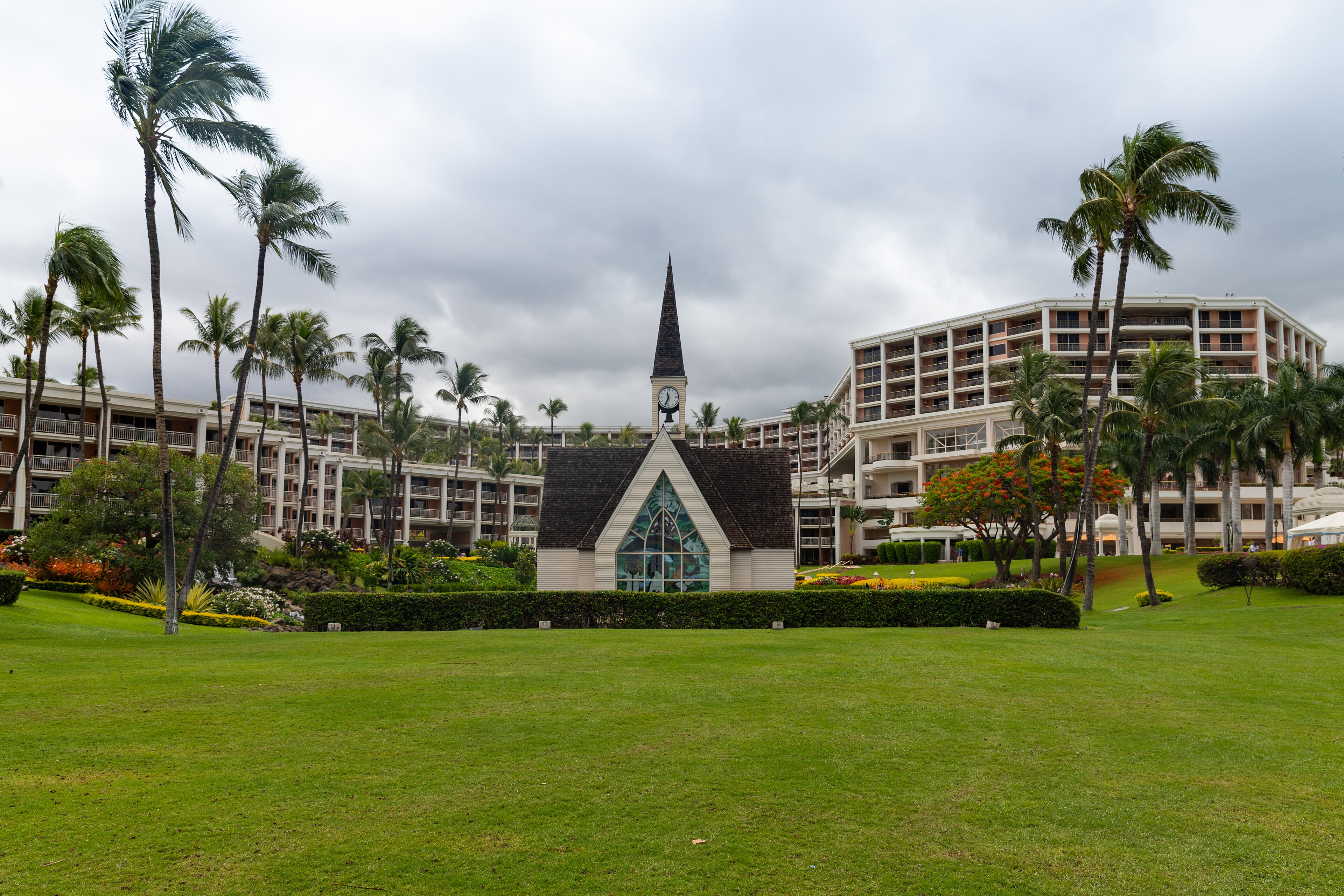 A wedding chapel framed by palms and resort gardens at Wailea on Maui