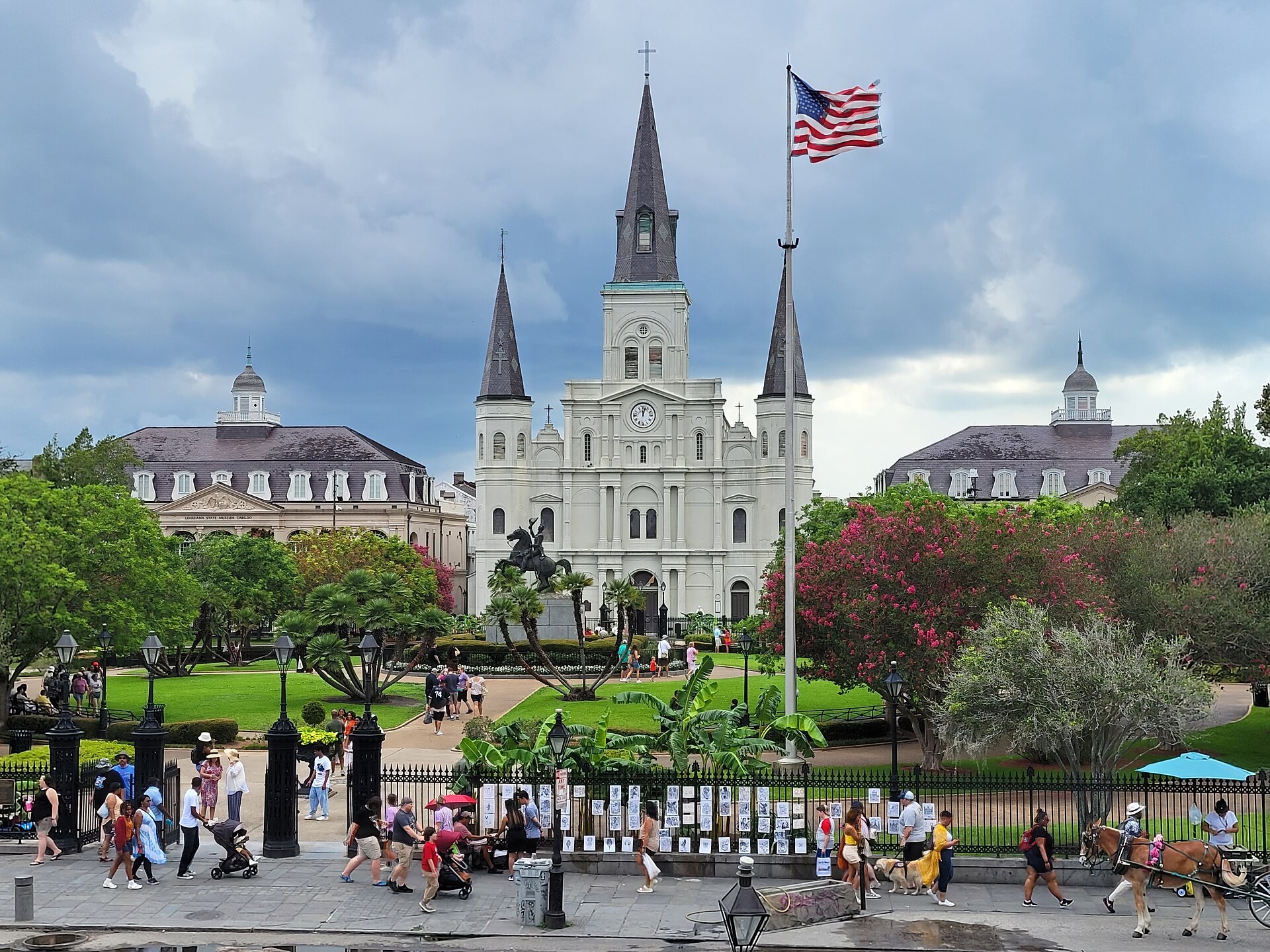 Travelers, artists, Jackson Square, and St. Louis Cathedral in the heart of New Orleans