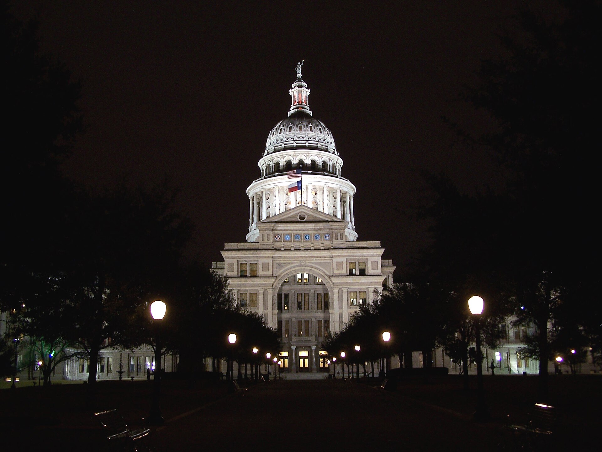 The illuminated Texas State Capitol and grounds in Austin at night