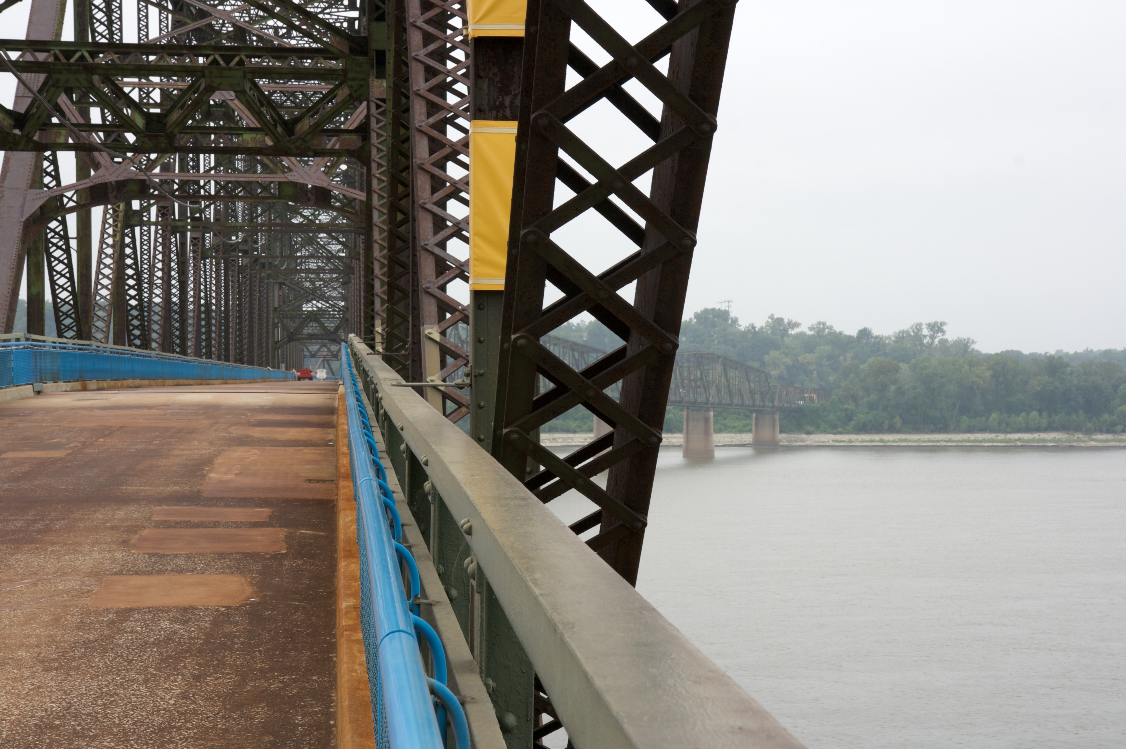The preserved Chain of Rocks Bridge bends across the Mississippi between Illinois and Missouri