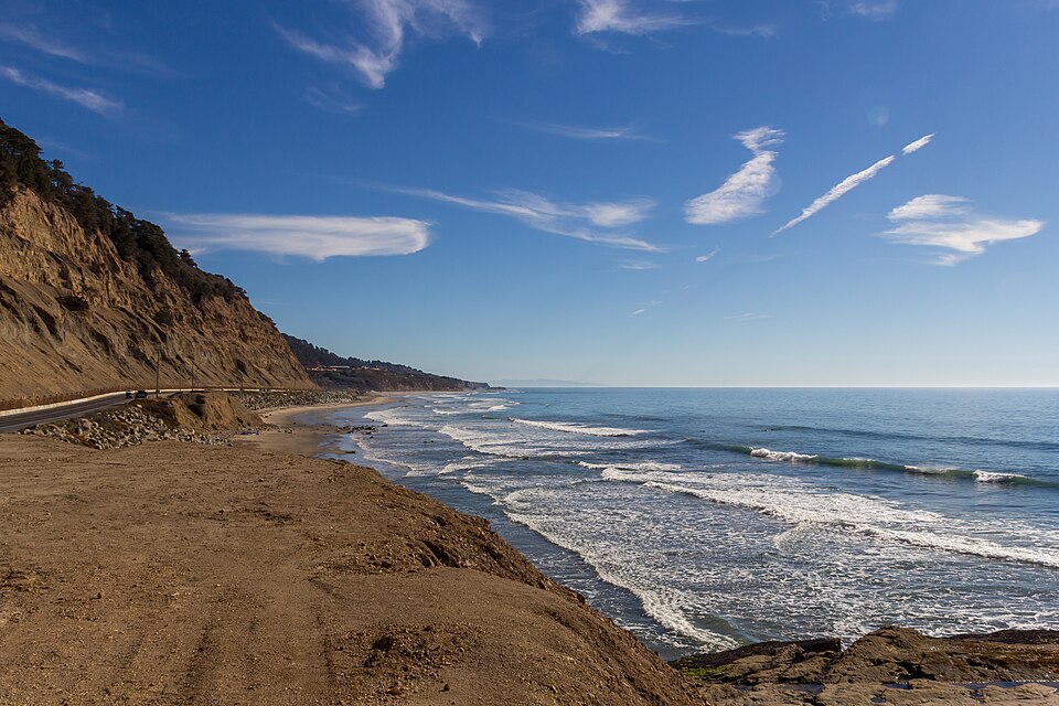 Highway 1 curving directly above the Pacific Ocean on California's central coast