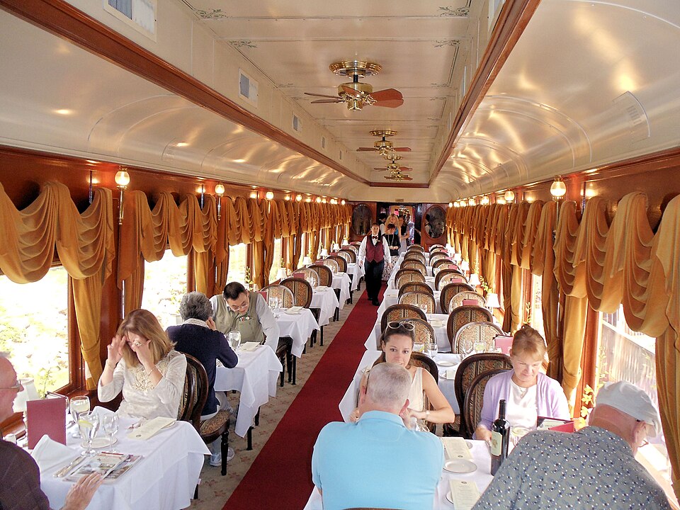 Travelers dining aboard the Napa Valley Wine Train during a California wine-country journey