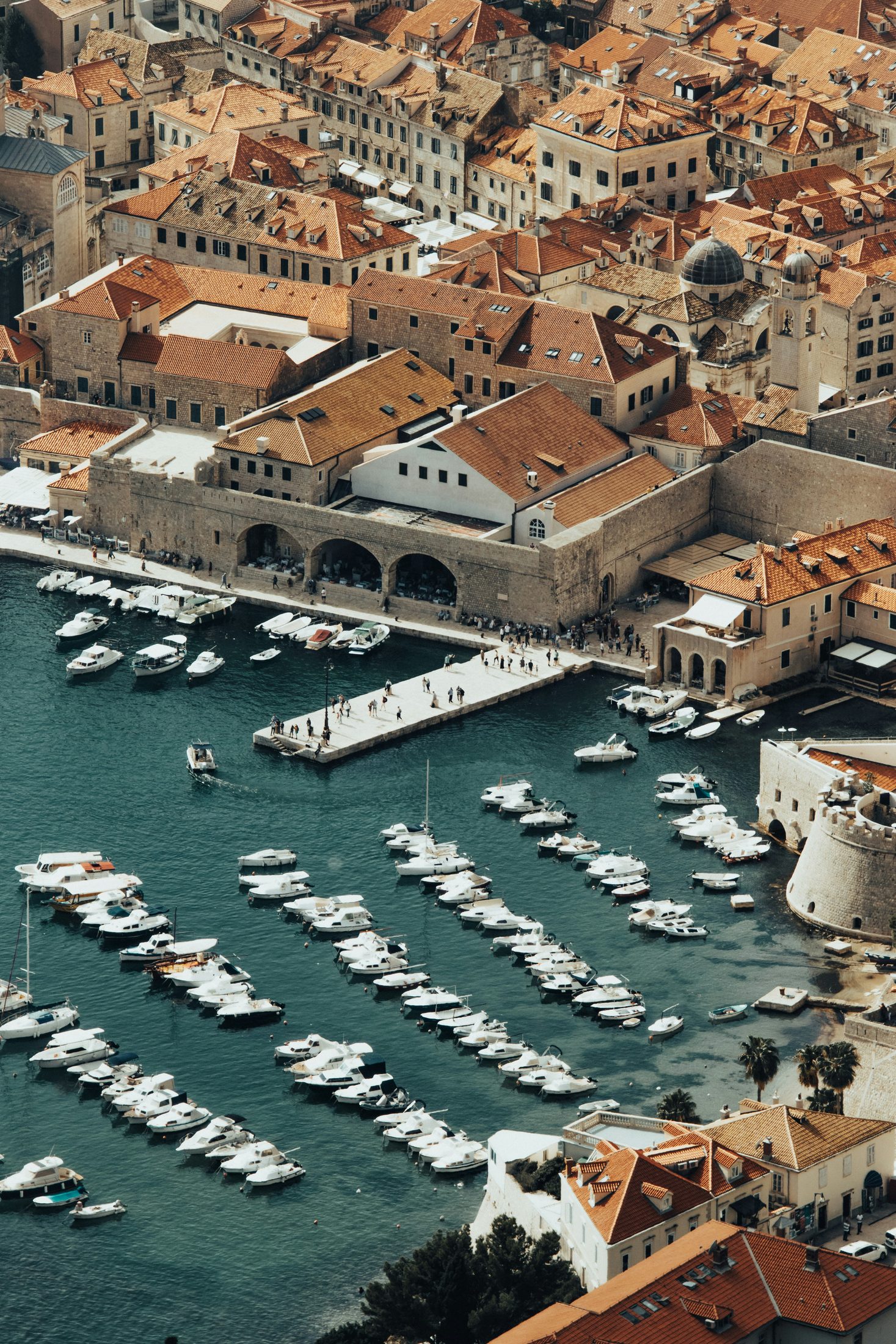 Aerial view of Dubrovnik Old Port, the old town, and Croatia's Adriatic coast
