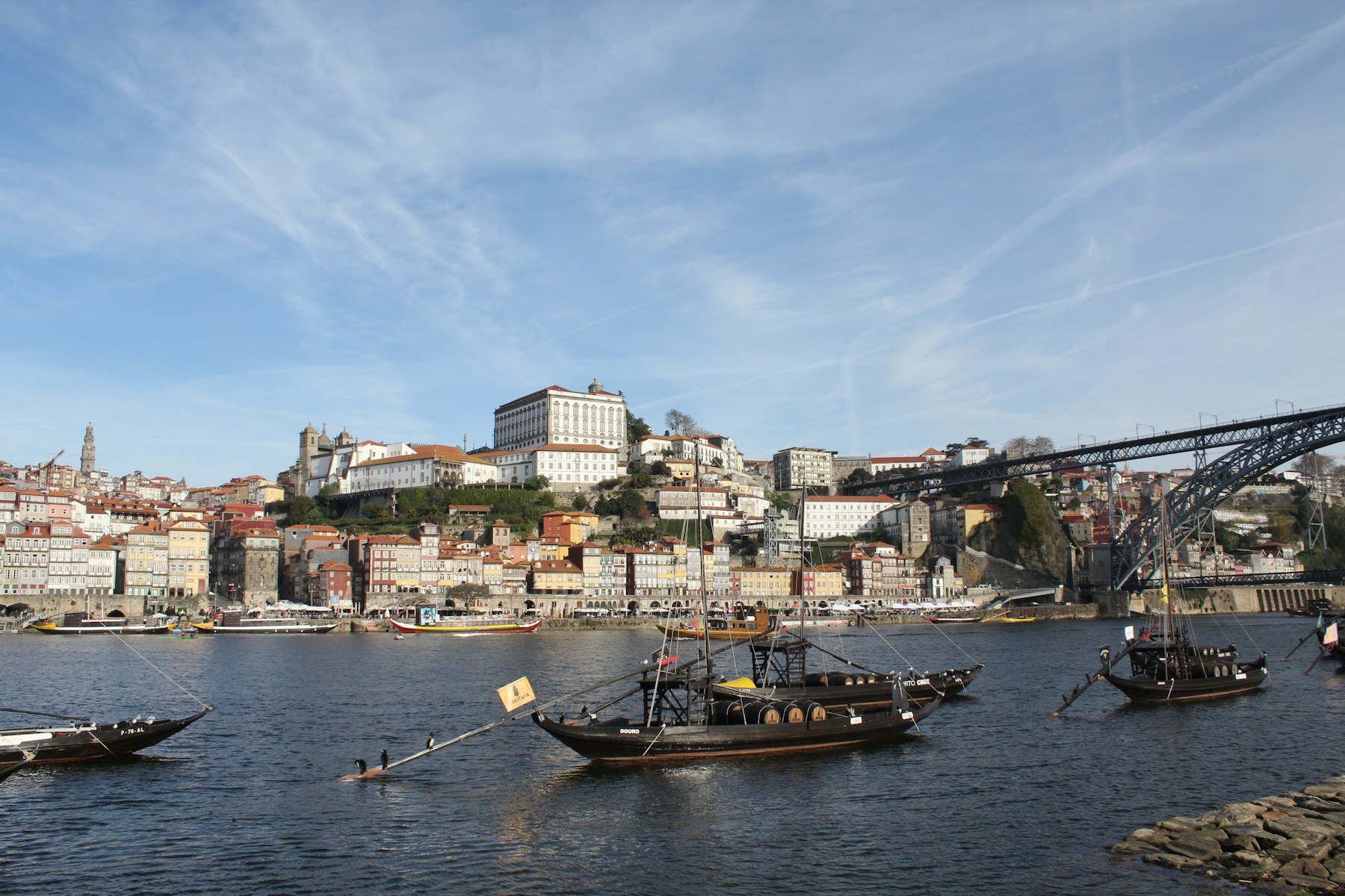 Porto riverfront buildings and rabelo boats along the Douro River