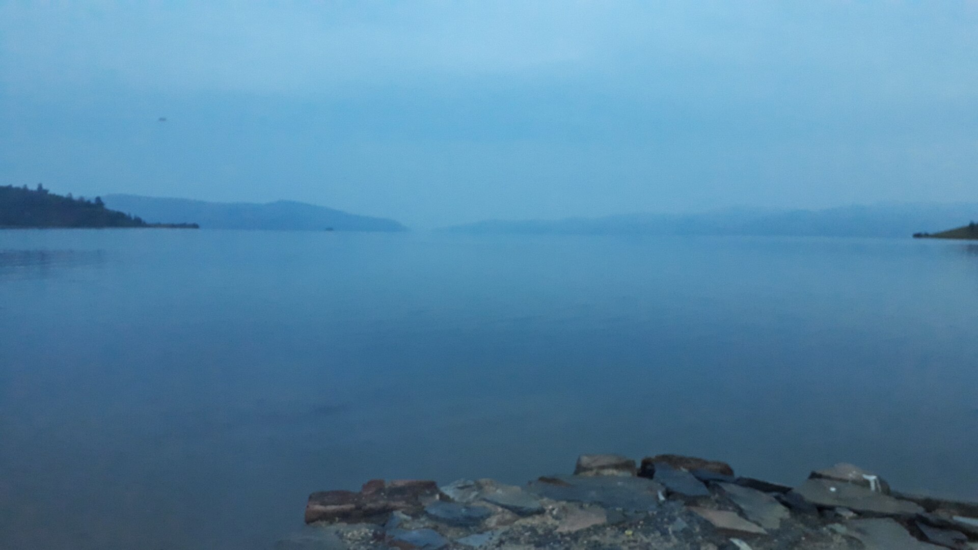 Soft dawn light over Lake Kivu, Rwanda, near the country's lakeside lodge circuit