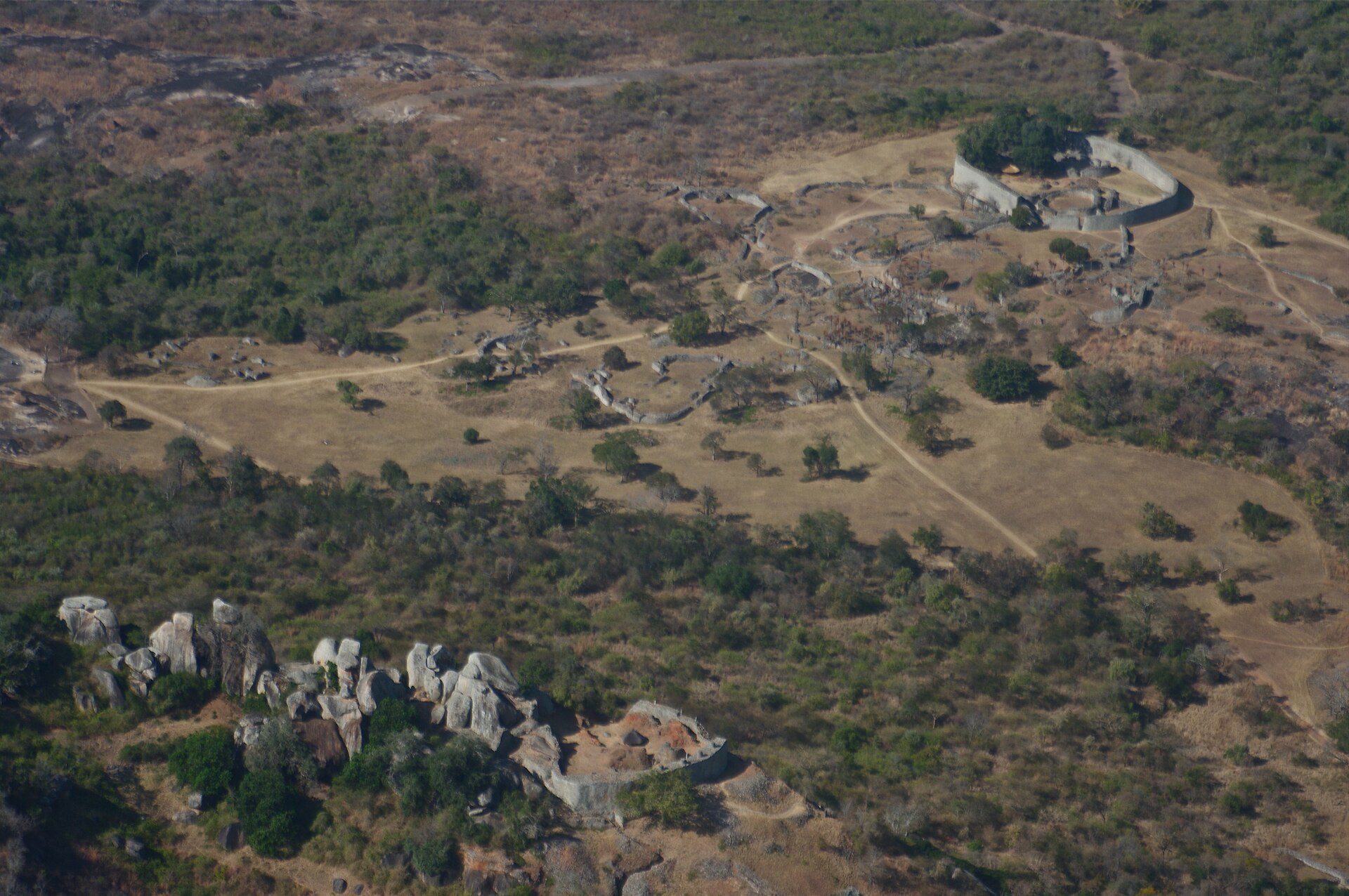 Aerial view of the stone enclosures and surrounding hills at Great Zimbabwe