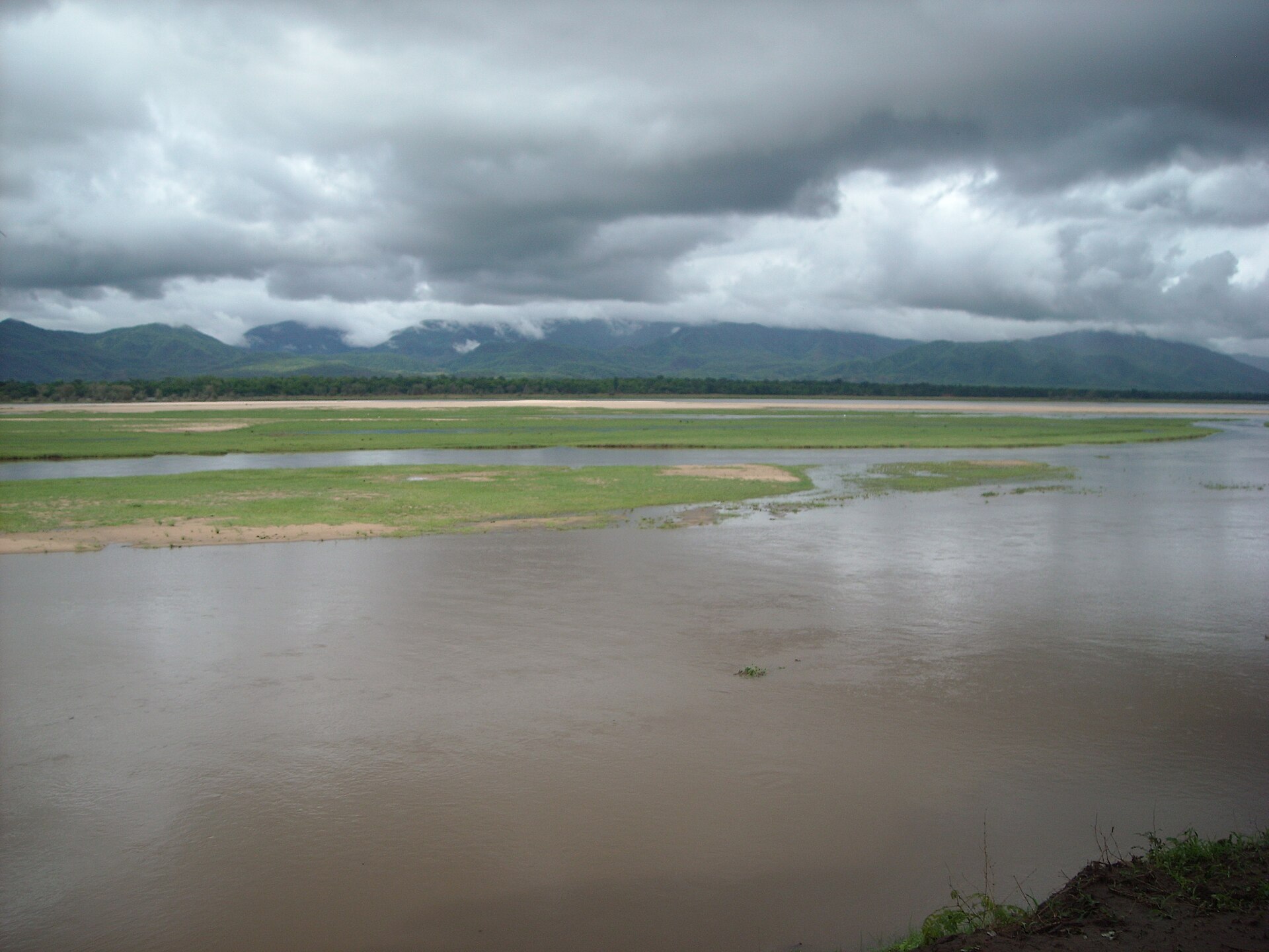 The broad Zambezi River and floodplain beneath storm clouds at Mana Pools, Zimbabwe